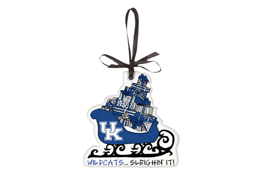 Decorative ornament with a blue sleigh and 'Wildcats... Sleighin' It!' text on a gray background
